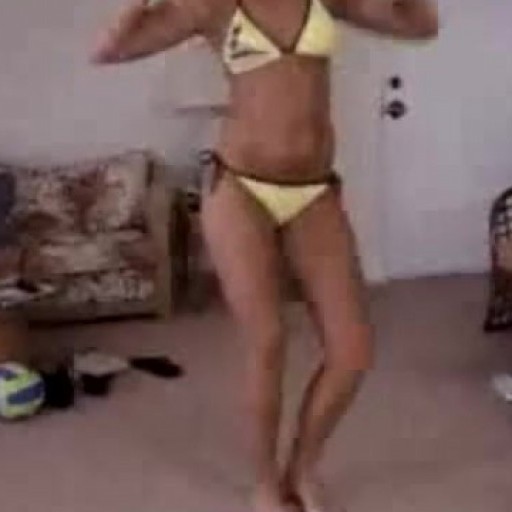 Hot chick dancing in yellow bikini
