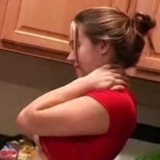 Big tit teen poses in the kitchen