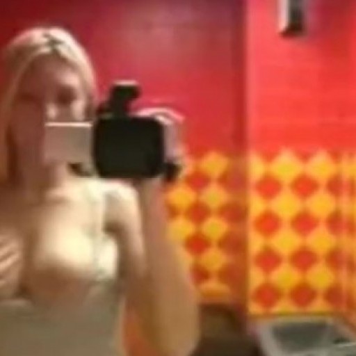 Hot busty blonde rubbs it out in the bathroom