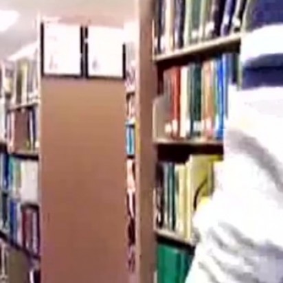 Guy Stroking in College Library