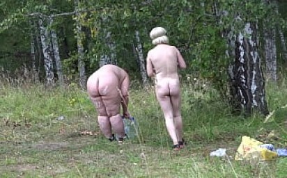 Voyeur spying on lesbians in nature. BBW with a big butt and her slender girlfriend with a hairy cunt wash in a clearing