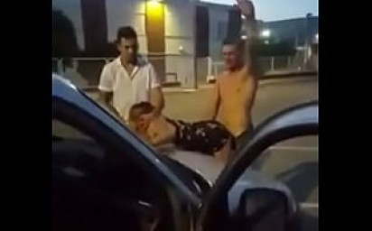 Two guys destroying their secretary in parking lot
