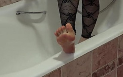 Unusual masturbation with a powerful shower jet in the bathroom. Hairy pussy and wet foot fetish.