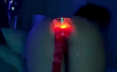 sexy girlfriend sticks a candle in her ass