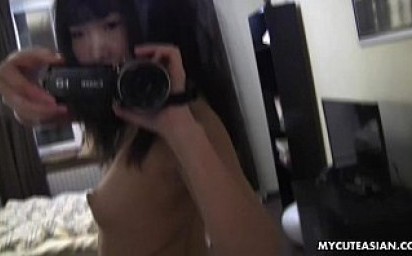 Spooked Asian babe rubbing her wet pussy as she masturbates