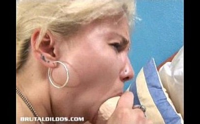 Blonde Russian fills her tight pussy with a big b. dildo
