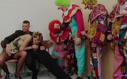 Husband invites group of clowns for his horny wife